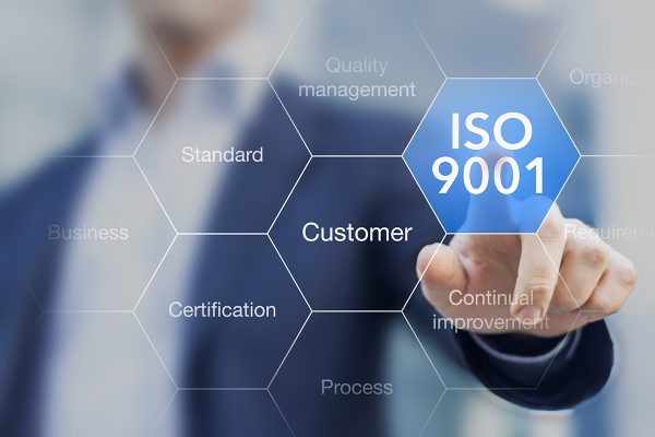 ISO 9001 standard for quality management of organizations with an auditor or manager in background